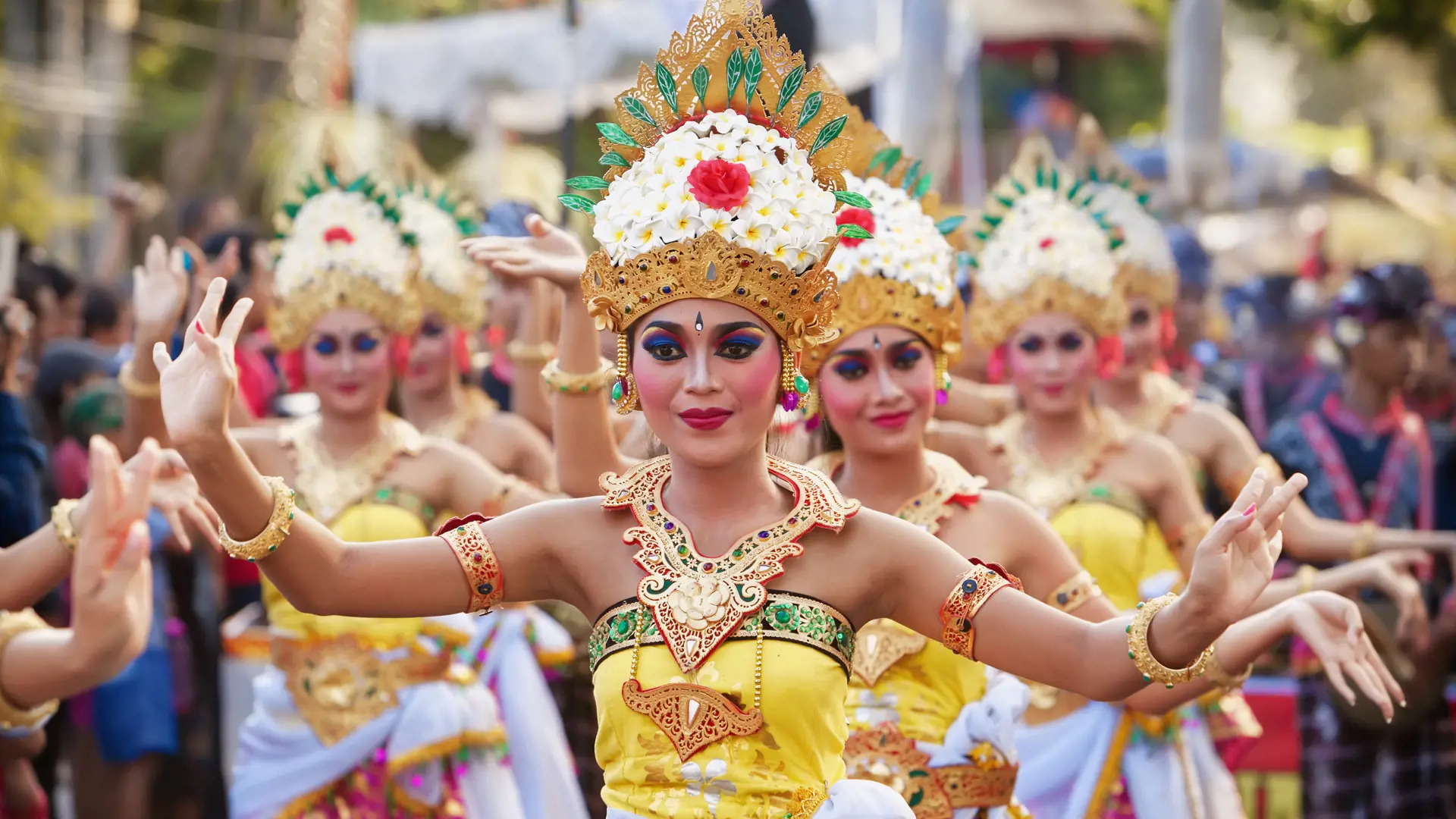 shutterstock_347774750 BALI, INDONESIA - JUNE 13, 2015 Women group dressed in colorful sarongs - Balinese style female dancer costume, dancing traditional temple dance Legong at Bali Art and Culture Festiv.jpg
