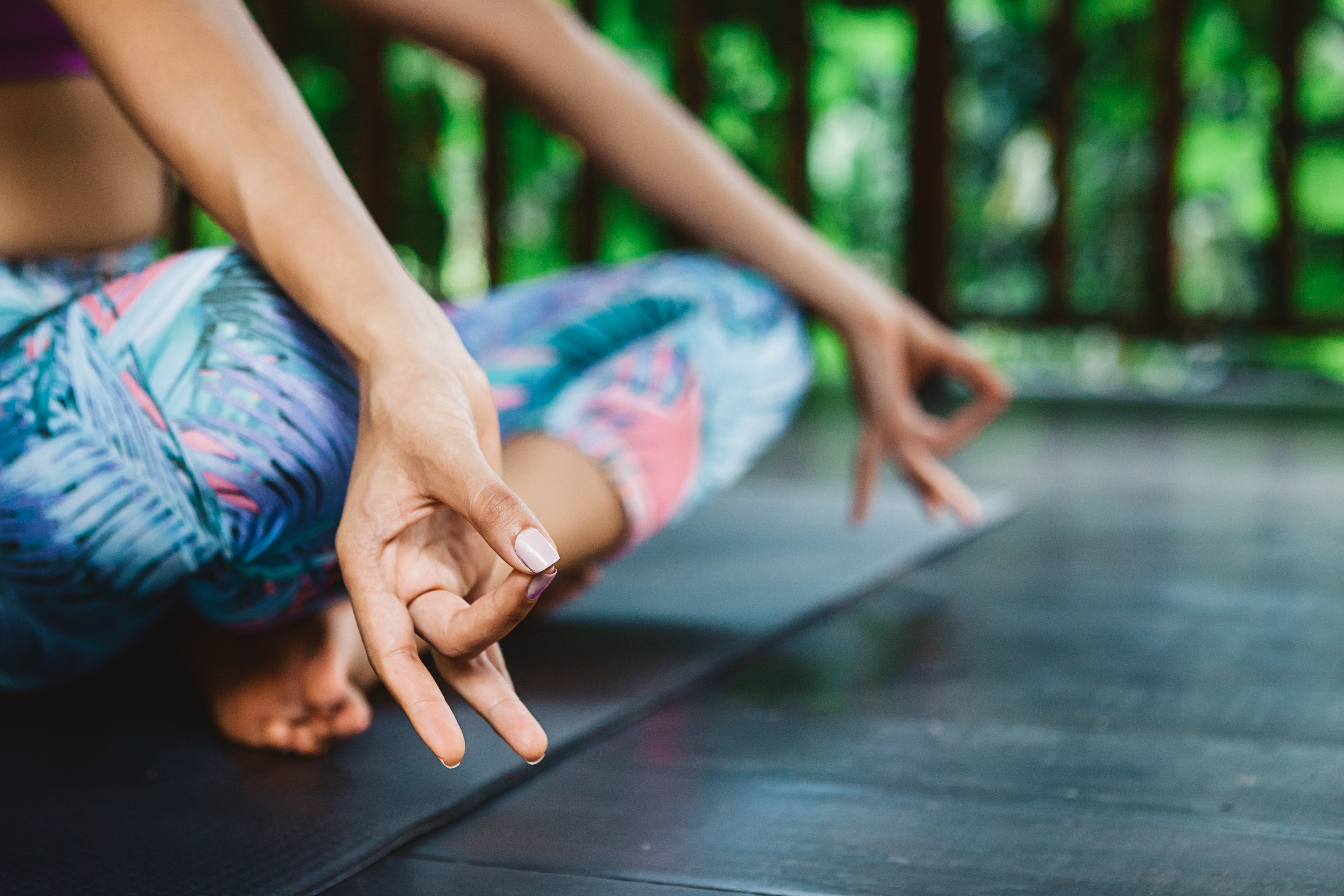 shutterstock_497435869 Young girl practicing yoga and meditation during vacation yoga retreat in Bali, fingers in mudra.jpg