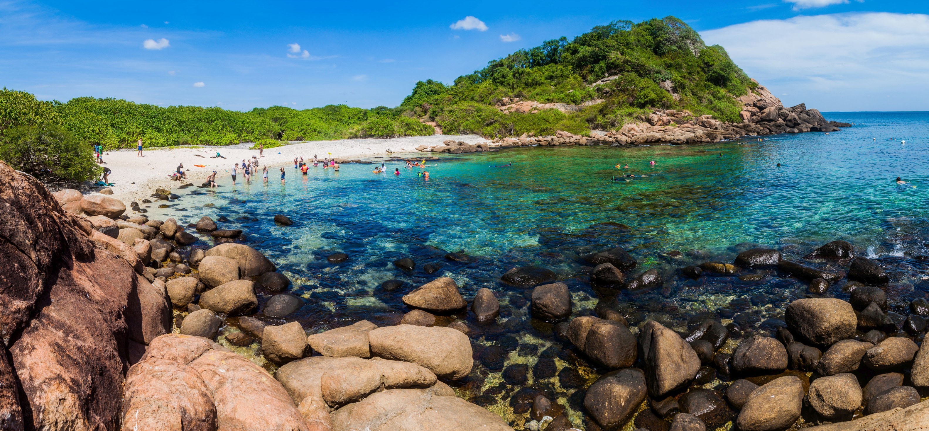 shutterstock_498185611 People snorkel on a coral reef in Pigeon Island National Park near Nilaveli village in Sri Lanka.jpg