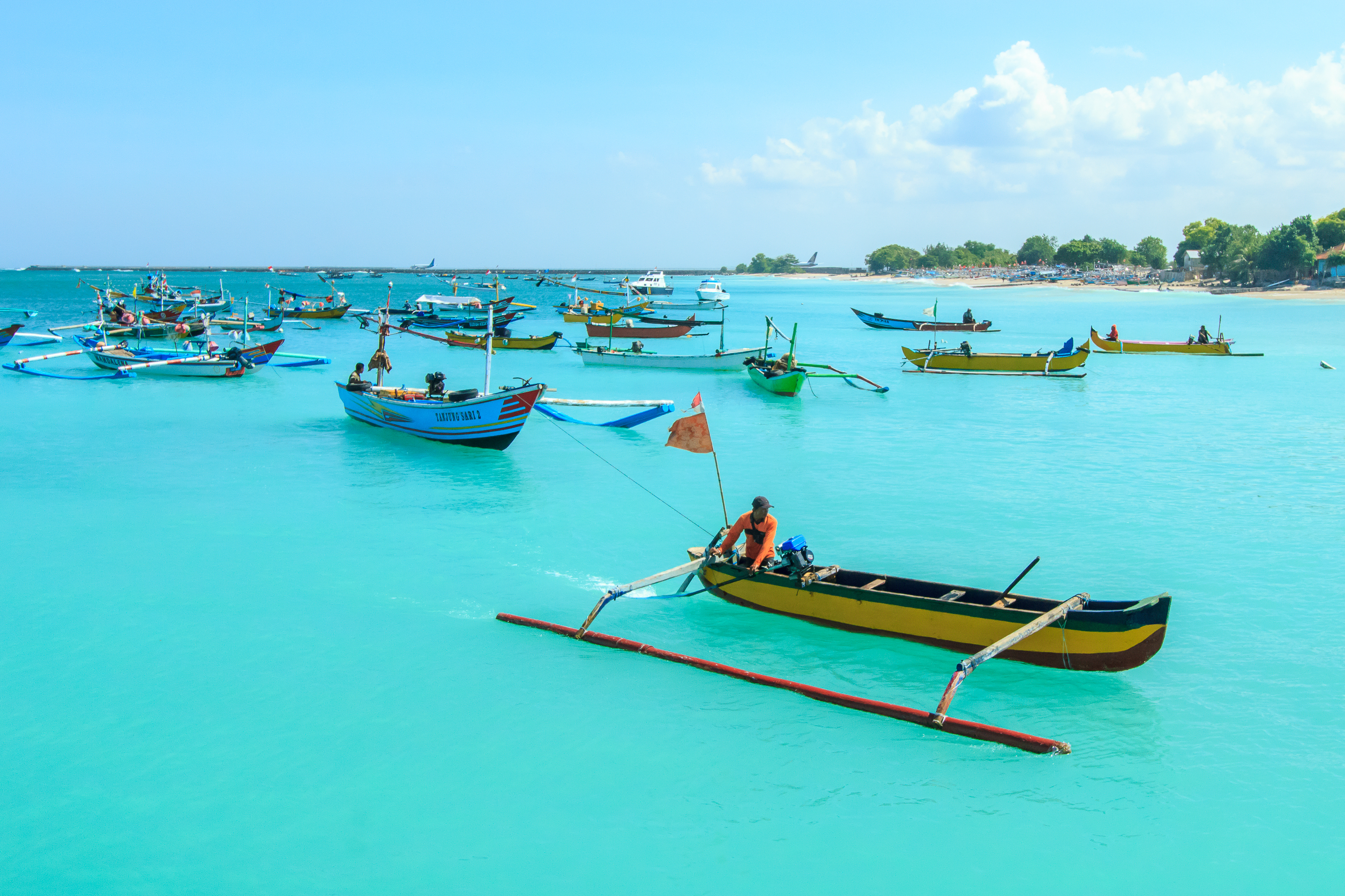 shutterstock_622035740 Bali, Indonesia-June 1, 2014Unidentified fisherman on a boat in Jimbaran Beach, Bali, Indonesia..jpg
