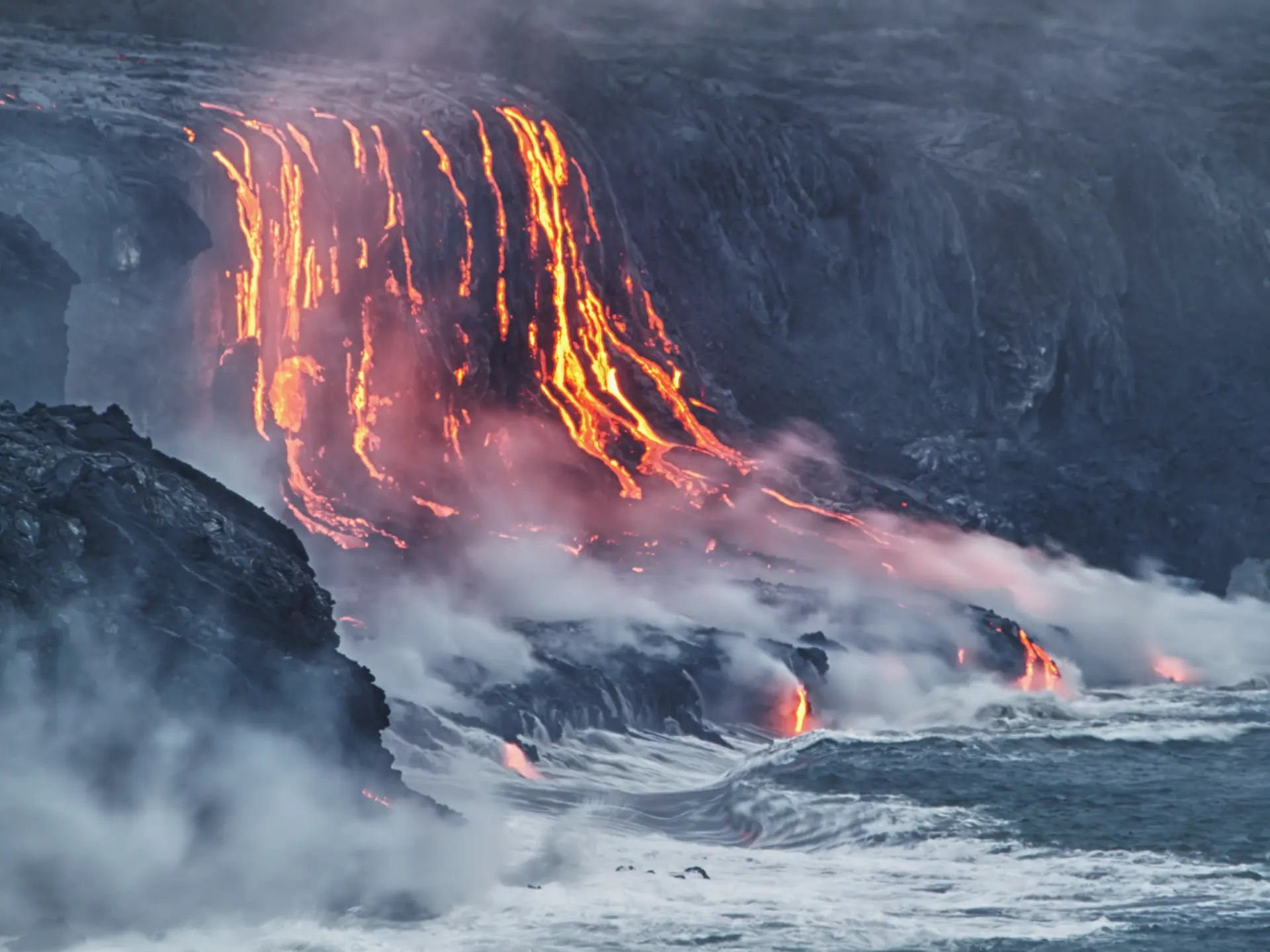 shutterstock_102905030 Lava erupting into Pacific Ocean in Hawaii Big Island.jpg