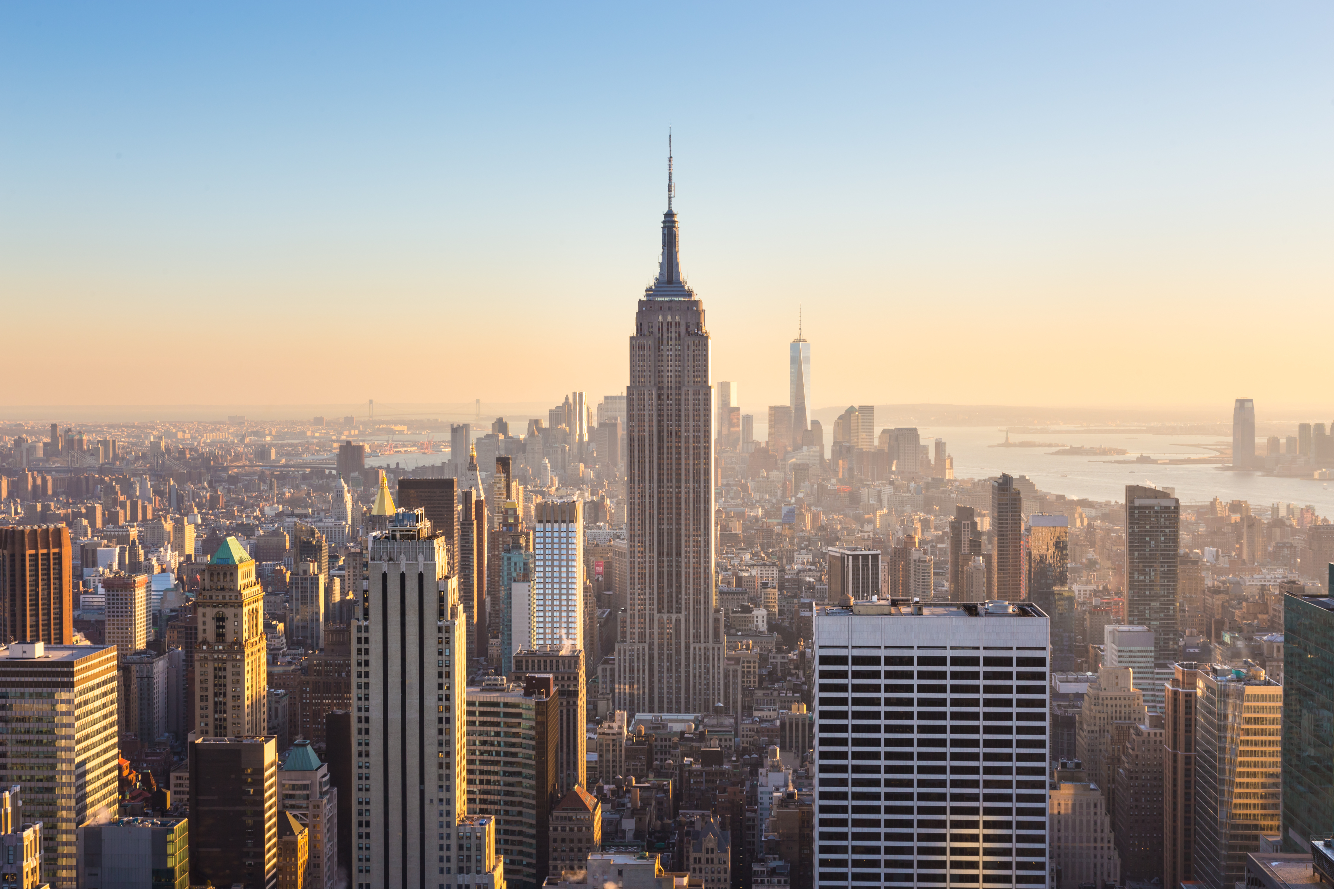 shutterstock_273724124 New York City. Manhattan downtown skyline with illuminated Empire State Building and skyscrapers..jpg