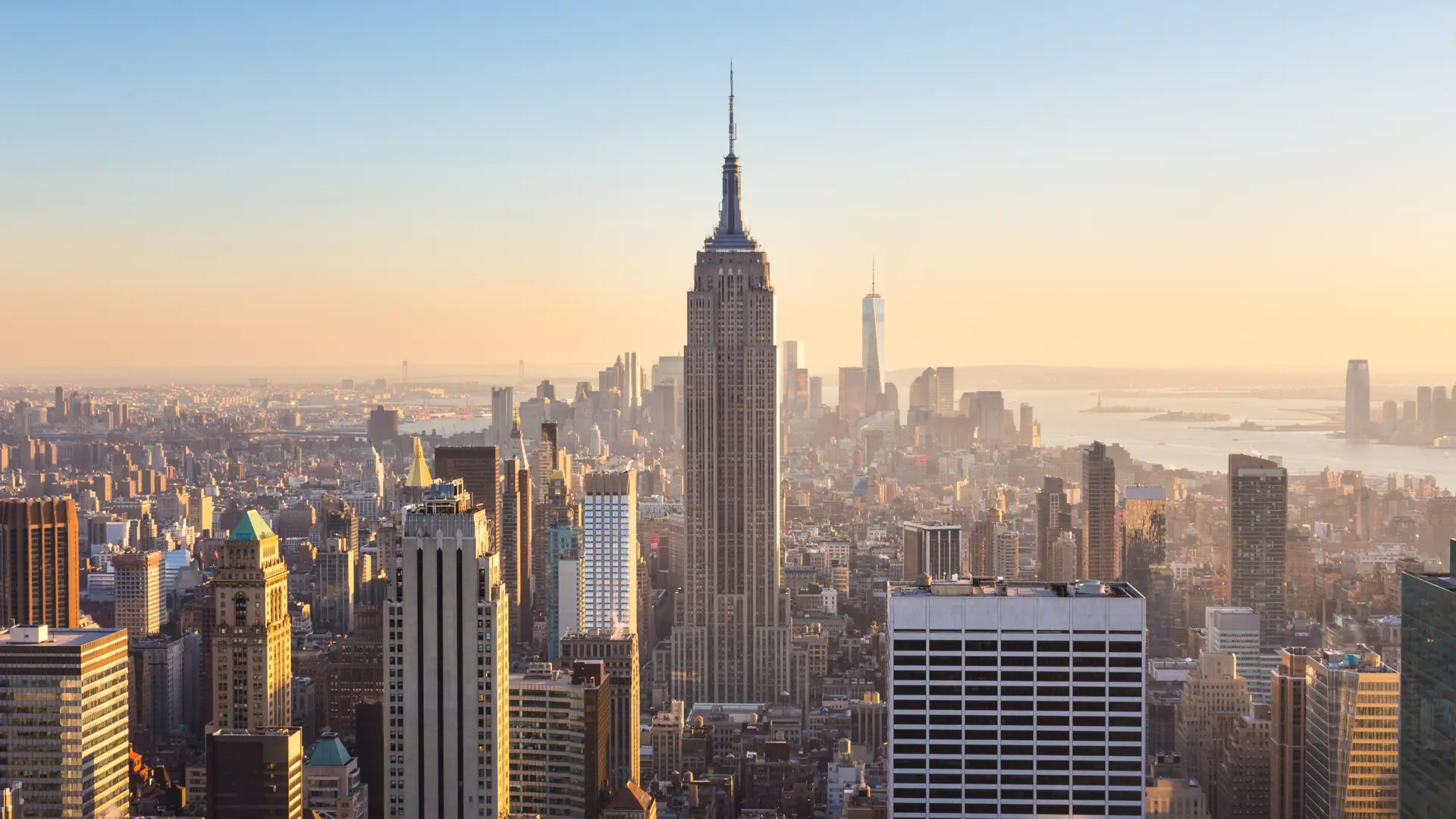 shutterstock_273724124 New York City. Manhattan downtown skyline with illuminated Empire State Building and skyscrapers..jpg