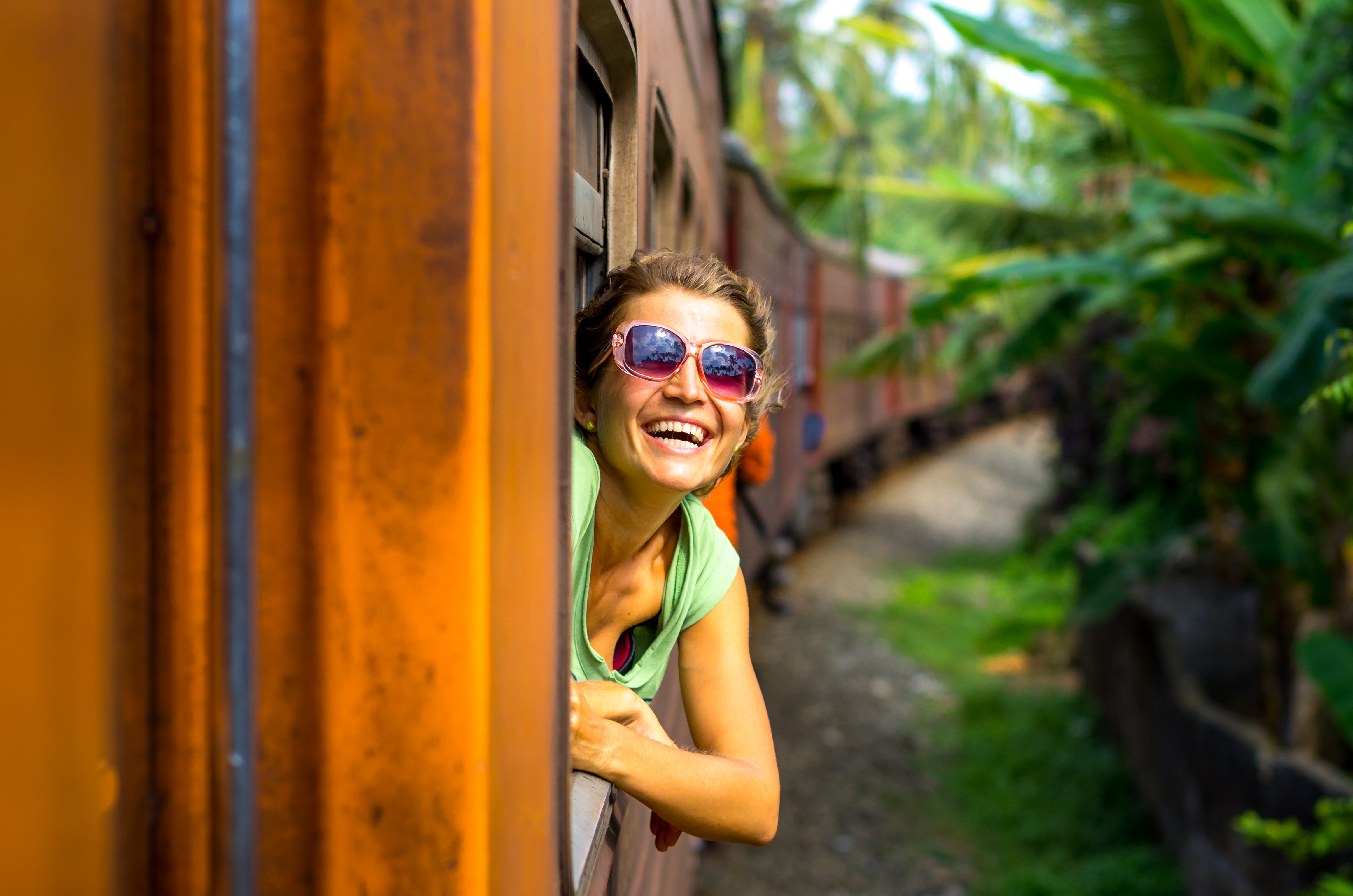 shutterstock_250535167 Young woman traveling by train in Sri Lanka.jpg