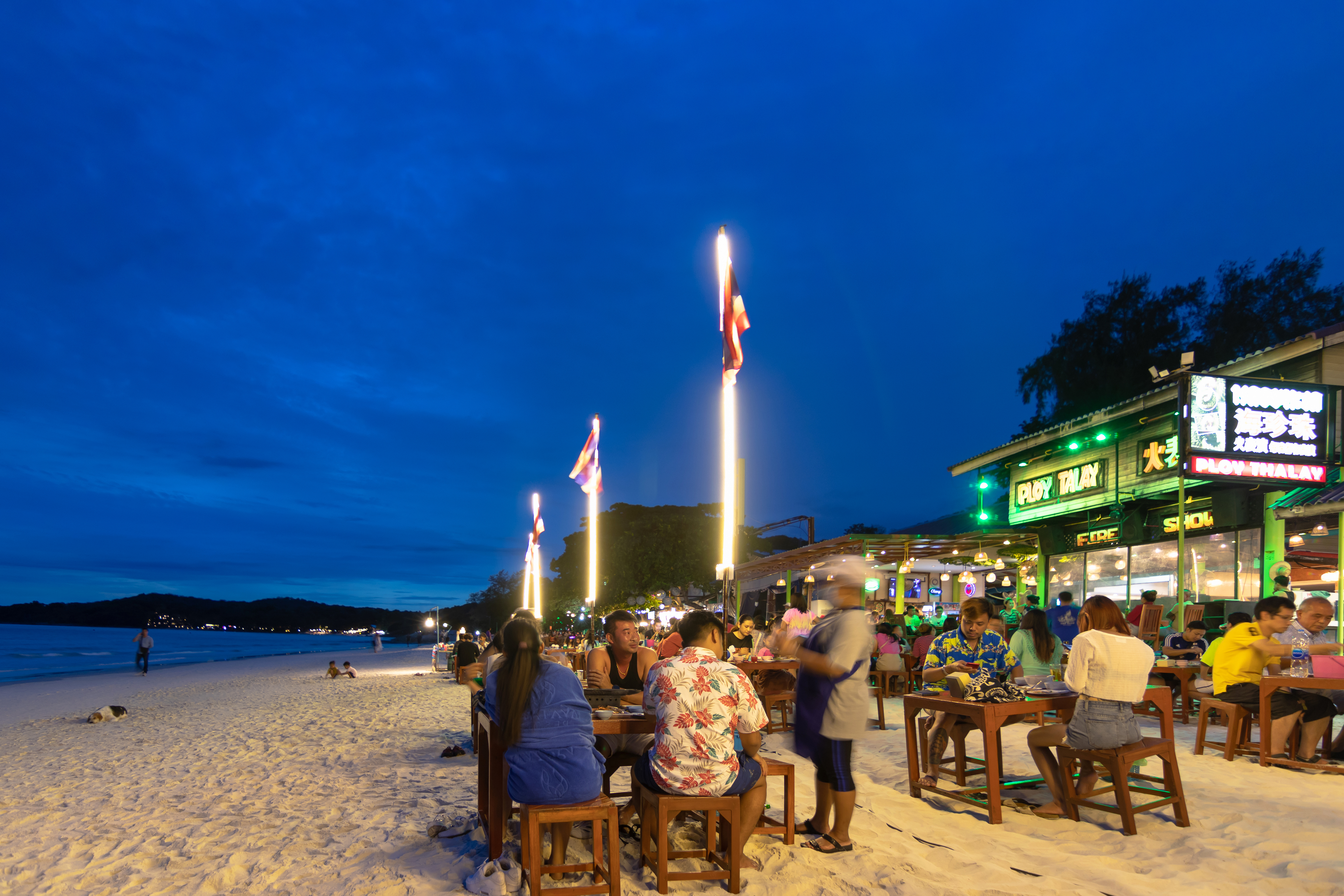 Shutterstock 1791898475 (Koh Samet, Thailand July, 2020 Tourists On Beach Front Restaurants At Sai Kaew Beach On The Island In Rayong, Gulf Of Thailand.)