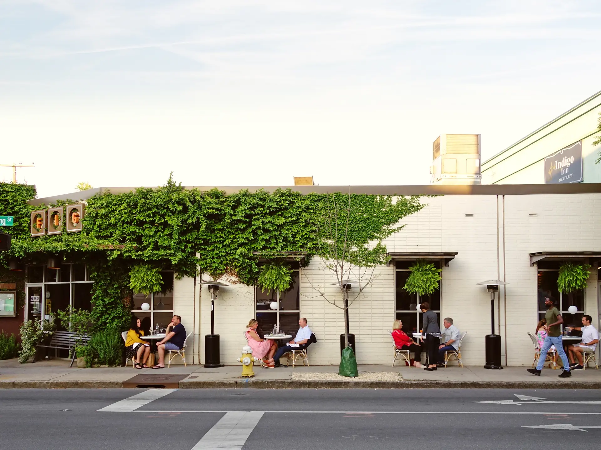 Shutterstock 2122742273 CHARLESTON , SC USA 04 20 2021 People Dining Outdoors At FIG Restaurant In Historic Charleston South Carolina