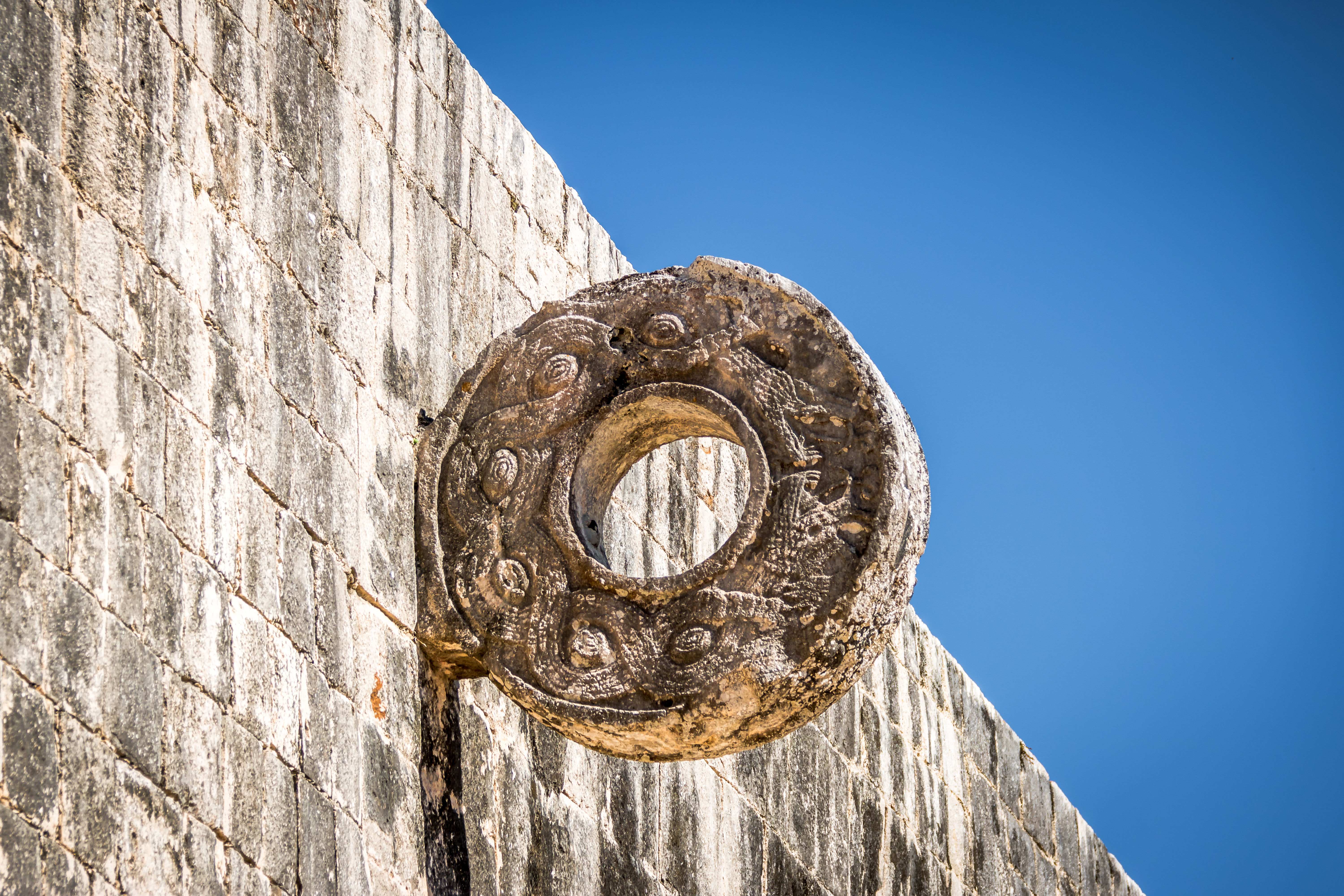 shutterstock_499950019 Detail of hoop at ball game court (juego de pelota) at Chichen Itza - Yucatan, Mexico.jpg