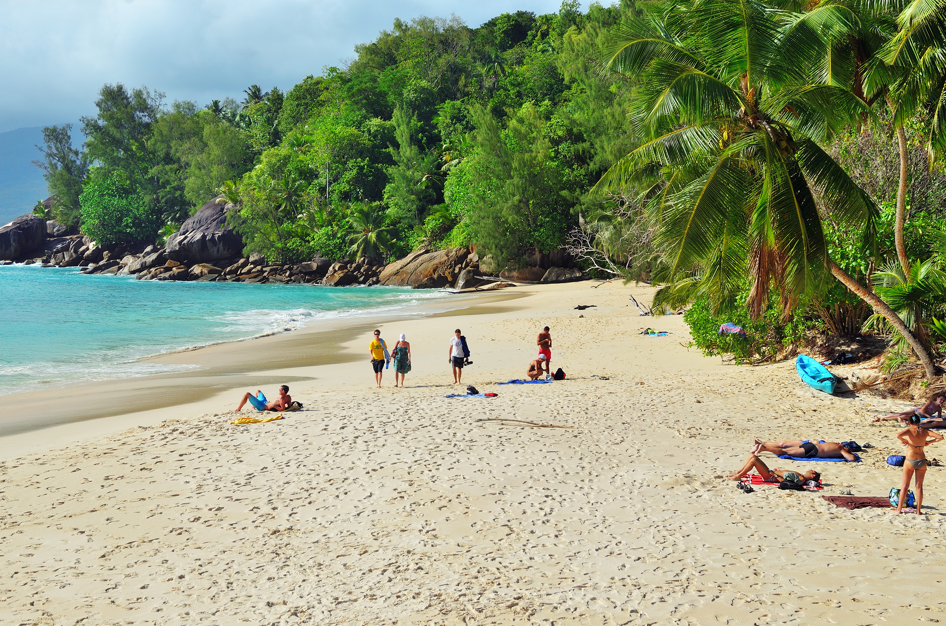 shutterstock_538980574 Tourists have a rest on the beautiful sandy beach Anse Soleil one from the most popular beaches at the island.jpg