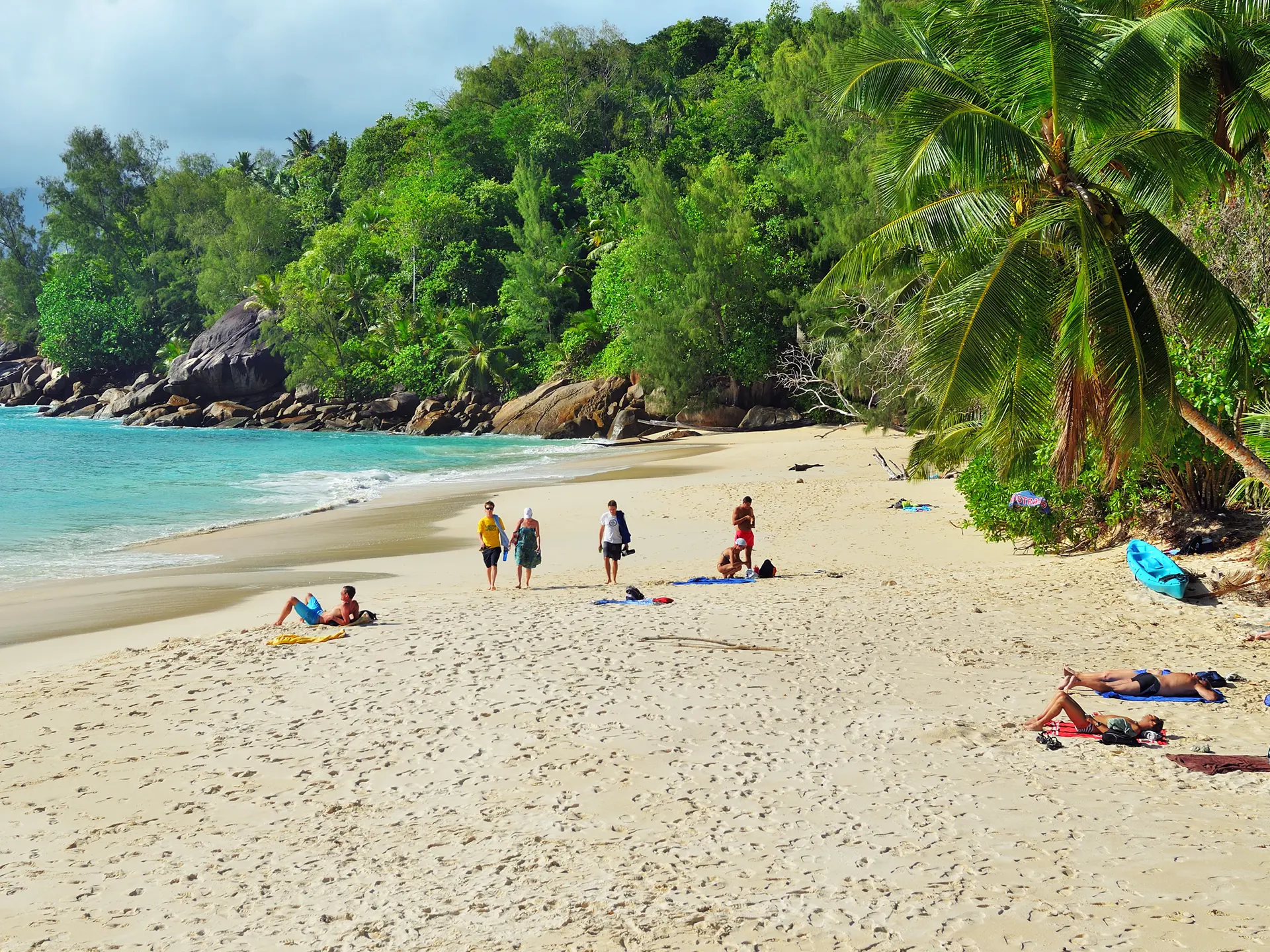 shutterstock_538980574 Tourists have a rest on the beautiful sandy beach Anse Soleil one from the most popular beaches at the island.jpg