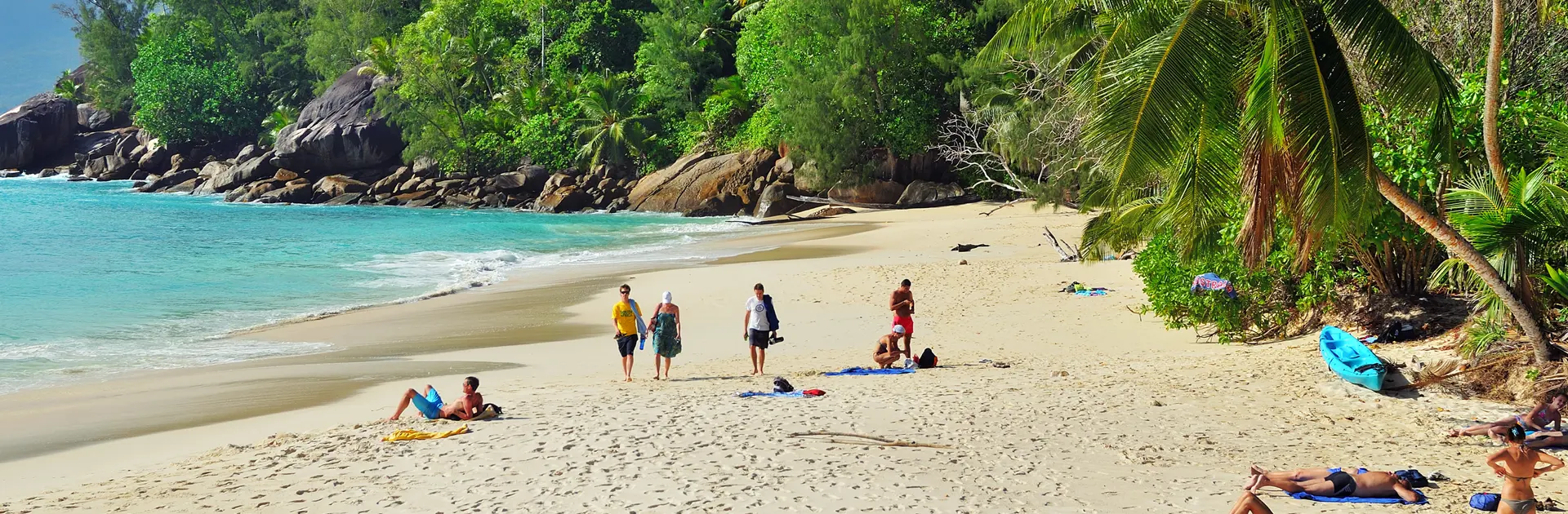 shutterstock_538980574 Tourists have a rest on the beautiful sandy beach Anse Soleil one from the most popular beaches at the island.jpg