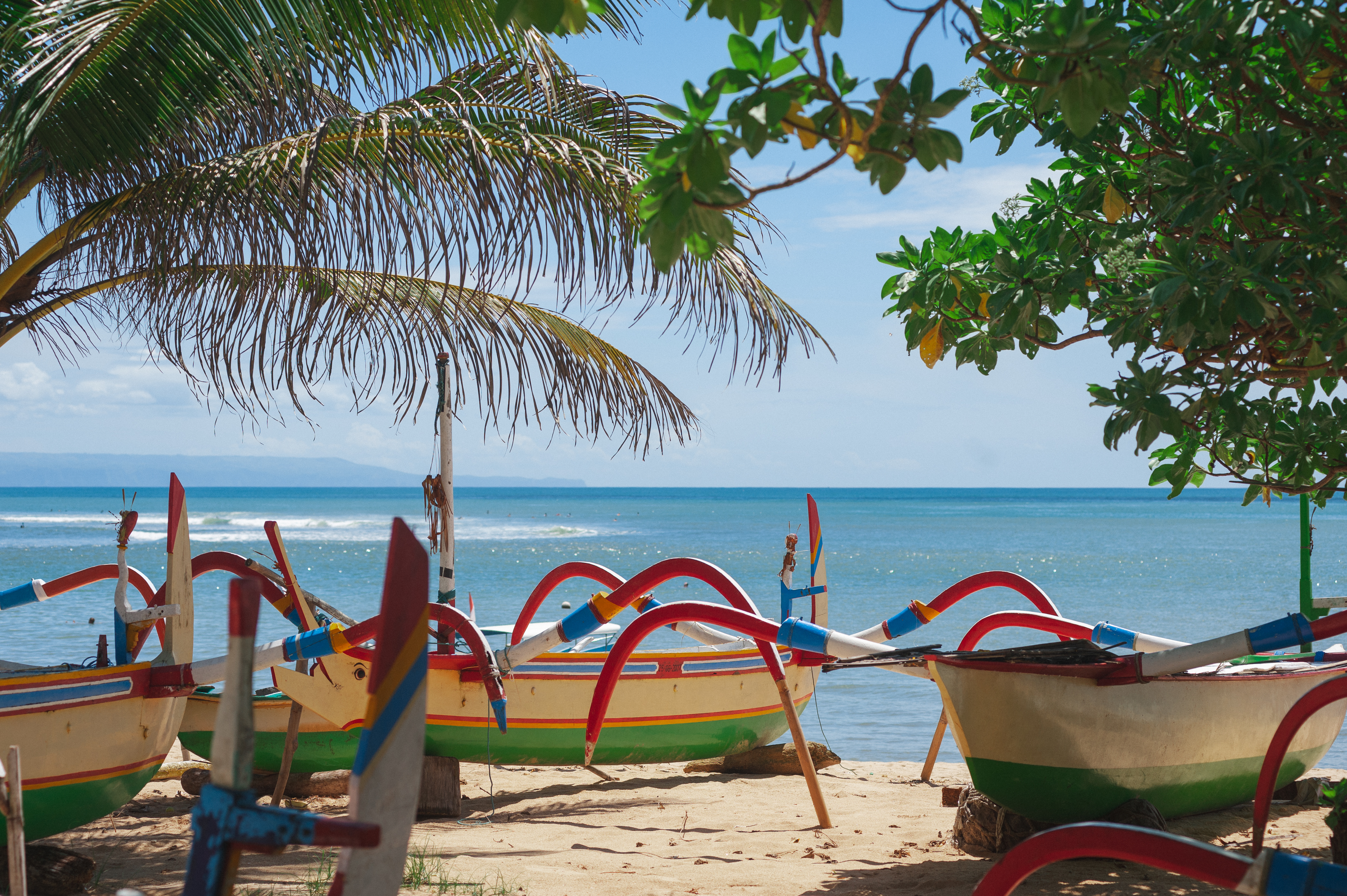 Shutterstock 1750491128 (Traditional Fisherman Boats On The Island Of Bali. Tropical Landscape, Beach View With Beautiful Palm Trees And Balinese Fishing Boats. Travel To Indonesia.)