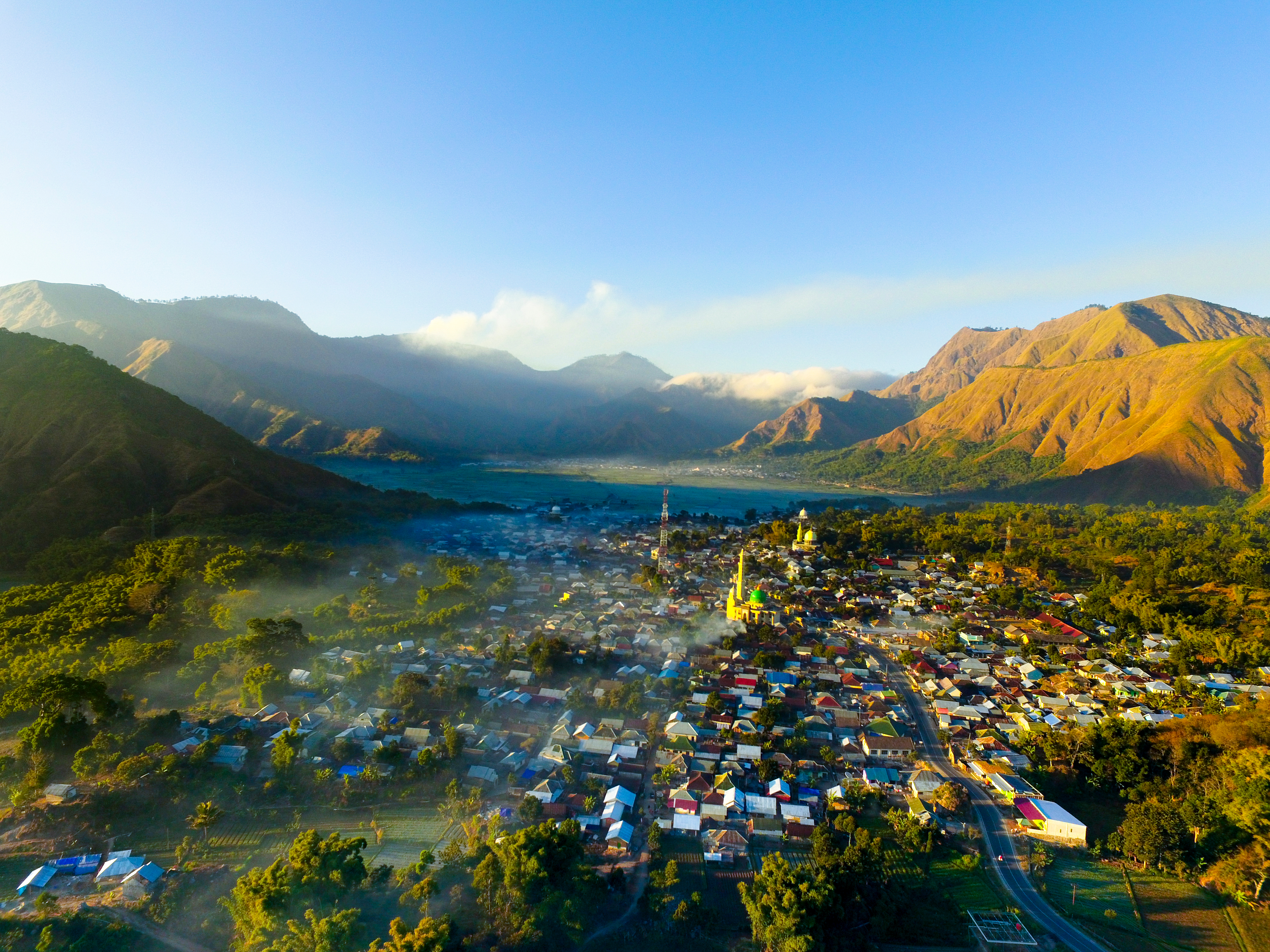 Shutterstock 1469449175 (Sembalun Village Near Rinjani Volcano In Lombok In The Morning With Sunrise And Foggy View. Aerial Paddy Field)